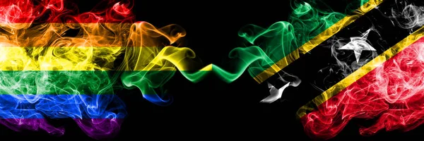 Bandeiras de fumaça Gay vs Saint Kitts e Nevis colocadas lado a lado. Bandeiras de fumo sedoso de cor grossa de Orgulho e São Cristóvão e Nevis — Fotografia de Stock