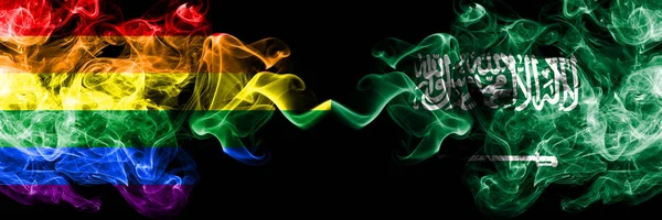 Gay vs Arábia Saudita, bandeiras de fumaça árabe colocados lado a lado. Bandeiras de fumo sedoso de cor grossa de Orgulho e Arábia Saudita, Árabe — Fotografia de Stock