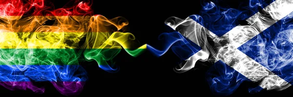 Gay vs Scotland, bandeiras de fumaça escocesas colocadas lado a lado. Bandeiras de fumo sedoso de cor grossa de Pride and Scotland, Scottish — Fotografia de Stock