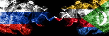 Rus vs Comoros, yan yana yerleştirilmiş Comorian duman bayrakları. Rusya ve Comorian 'ın kalın renkli dumanlı bayrakları.