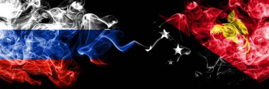 Rus, Papua Yeni Gine 'ye karşı yan yana yerleştirilmiş duman bayrakları. Rusya ve Papua Yeni Gine 'nin kalın renkli dumanlı bayrakları
