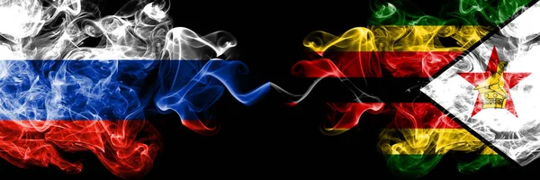 Rosyjski vs Zimbabwe, Zimbabwe dym flagi umieszczone obok siebie. Grube kolorowe, jedwabiste flagi dymu z Rosji i Zimbabwe, Zimbabwe — Zdjęcie stockowe