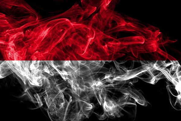 Mônaco fumaça bandeira isolada no fundo preto — Fotografia de Stock