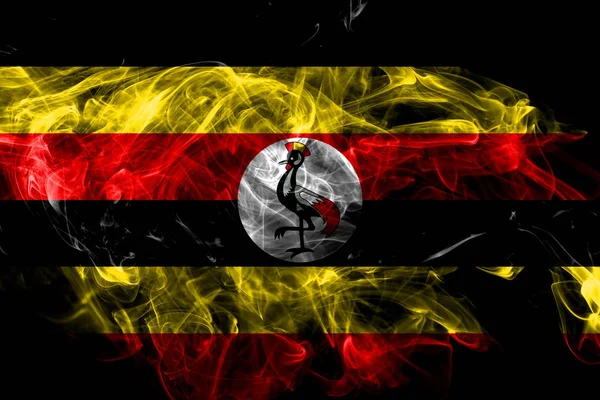 Uganda bandiera di fumo isolata su sfondo nero — Foto Stock