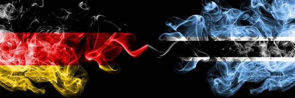 Germany vs Botswana, Botswanan smoky mystic flags placed side by side. Thick colored silky smoke flags of Deutschland and Botswana, Botswanan — Stock Photo, Image