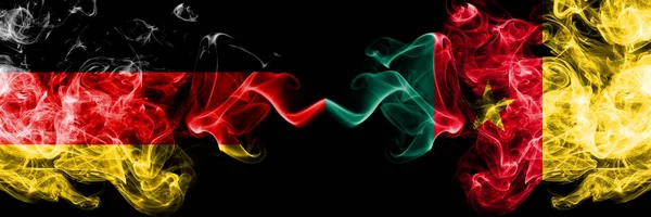 Germany vs Cameroon, Cameroonian smoky mystic flags placed side by side. Thick colored silky smoke flags of Deutschland and Cameroon, Cameroonian — Stock Photo, Image