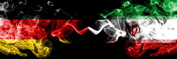 Germany vs Iran, Iranian smoky mystic flags placed side by side. Thick colored silky smoke flags of Deutschland and Iran, Iranian — Stock Photo, Image