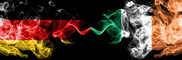 Germany vs Ireland, Irish smoky mystic flags placed side by side. Thick colored silky smoke flags of Deutschland and Ireland, Irish — Stock Photo, Image