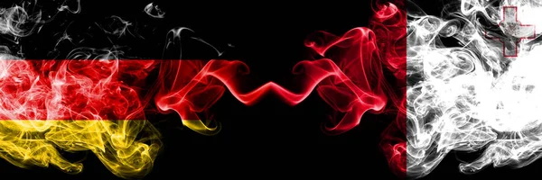 Germany vs Malta, Maltese smoky mystic flags placed side by side. Thick colored silky smoke flags of Deutschland and Malta, Maltese — Stock Photo, Image