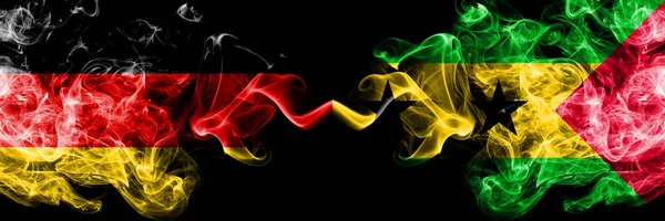 Germany vs Sao Tome and Principe smoky mystic flags placed side by side. Thick colored silky smoke flags of Deutschland and Sao Tome and Principe — Stock Photo, Image