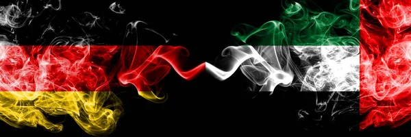 Germany vs United Arab Emirates, Emirati smoky mystic flags placed side by side. Thick colored silky smoke flags of Deutschland and United Arab Emirates, Emirati — Stock Photo, Image