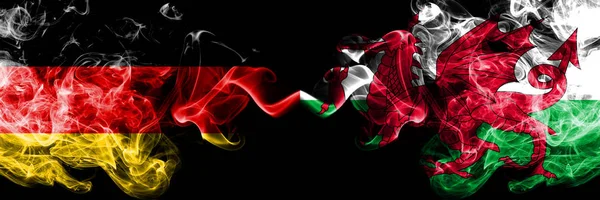 Germany vs Wales, Welsh smoky mystic flags placed side by side. Thick colored silky smoke flags of Deutschland and Wales, Welsh — Stock Photo, Image