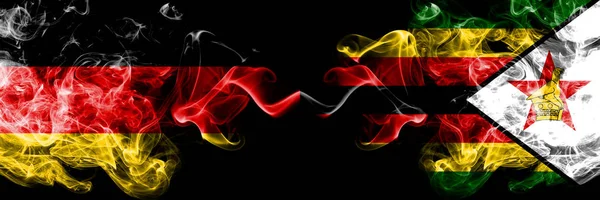 Germany vs Zimbabwe, Zimbabwean smoky mystic flags placed side by side. Thick colored silky smoke flags of Deutschland and Zimbabwe, Zimbabwean — Stock Photo, Image