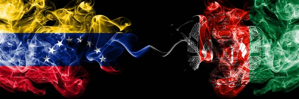 Venezuela vs Afghanistan, Afghani smoky mystic flags placed side by side. Thick colored silky smoke flags of Venezuela and Afghanistan, Afghani — Stock Photo, Image