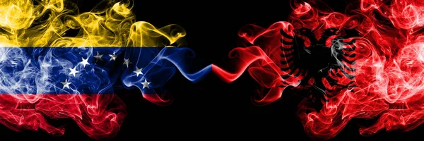 Venezuela vs Albania, Albanian smoky mystic flags placed side by side. Thick colored silky smoke flags of Venezuela and Albania, Albanian — Stock Photo, Image