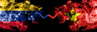 Venezuela Vietnam 'a karşı, Vietnam dumanlı mistik bayrakları yan yana yerleştirildi. Venezuela ve Vietnam 'ın kalın renkli dumanlı bayrakları, Vietnamca