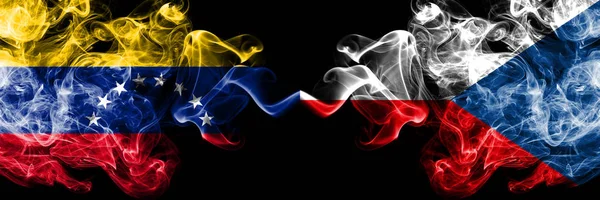 Venezuela vs Czech Republic smoky mystic flags placed side by side. Thick colored silky smoke flags of Venezuela and Czech Republic