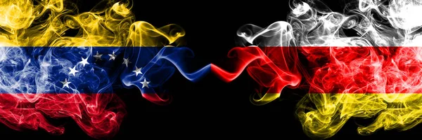 Venezuela vs South Ossetia smoky mystic flags placed side by side. Thick colored silky smoke flags of Venezuela and South Ossetia — Stock Photo, Image