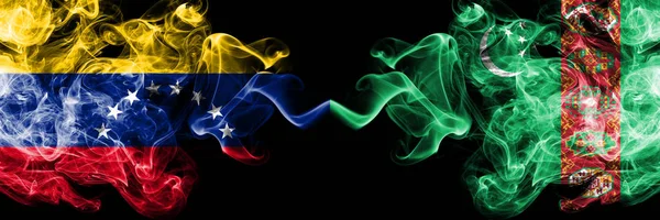 Venezuela vs Turkmenistan, Turkmenistans smoky mystic flags placed side by side. Thick colored silky smoke flags of Venezuela and Turkmenistan, Turkmenistans — Stock Photo, Image