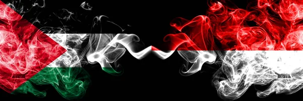 Palestine vs Indonesia, Indonesian smoky mystic flags placed side by side. Thick colored silky smokes flag of Palestinians and Indonesia, Indonesian — Stock Photo, Image