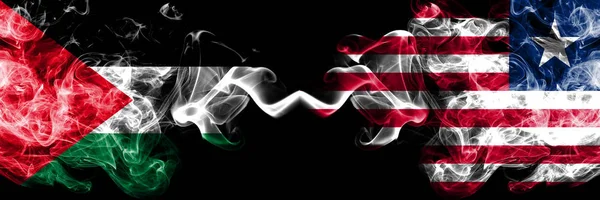 Palestina vs Libéria, bandeiras místicas de fumo liberiano colocadas lado a lado. Bandeira de fumaça sedosa de cor grossa de palestinos e Libéria, Libéria — Fotografia de Stock