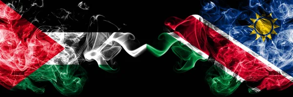巴勒斯坦对纳米比亚，纳米比亚烟熏神秘旗帜并排放置。厚厚的彩色丝烟国旗的巴勒斯坦人和纳米比亚，纳米比亚 — 图库照片
