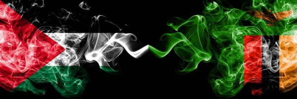 Palestine vs Zambia, Zambian smoky mystic flags placed side by side. Thick colored silky smokes flag of Palestinians and Zambia, Zambian — Stock Photo, Image