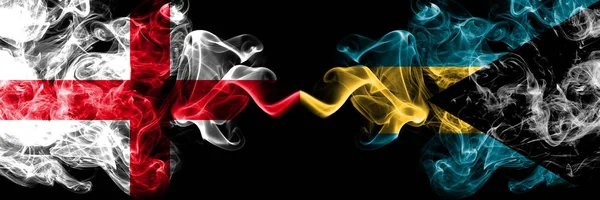 English vs Bahamas, Bahamian smoky mystic flags placed side by side. Thick colored silky smokes flag of England and Bahamas, Bahamian. — Stock Photo, Image
