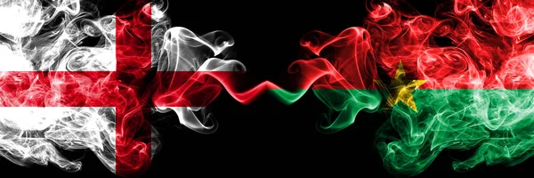 English vs Burkina Faso smoky mystic flags placed side by side. Thick colored silky smokes flag of England and Burkina Faso. — Stock Photo, Image
