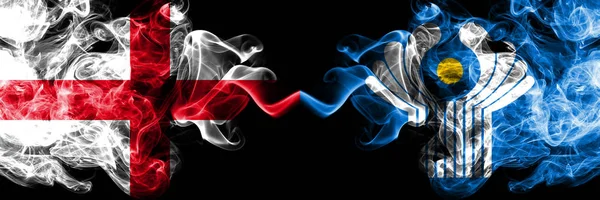 English vs Commonwealth smoky mystic flags placed side by side. Thick colored silky smokes flag of England and Commonwealth. — Stock Photo, Image