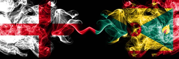 English vs Grenada smoky mystic flags placed side by side. Thick colored silky smokes flag of England and Grenada. — Stock Photo, Image