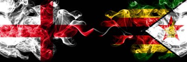İngilizce vs Zimbabve, Zimbabve dumanlı mistik bayraklar yan yana yerleştirilir. Kalın renkli ipeksi İngiltere ve Zimbabve, Zimbabve bayrağı dumanlar.