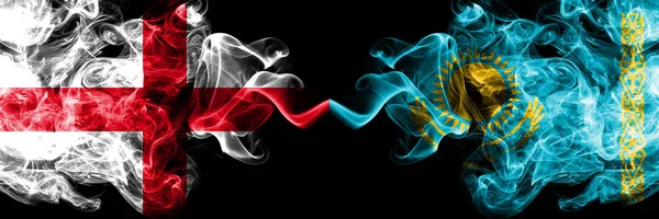 English vs Kazakhstan, Kazakhstani smoky mystic flags placed side by side. Thick colored silky smokes flag of England and Kazakhstan, Kazakhstani. — Stock Photo, Image