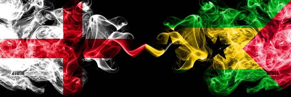 English vs Sao Tome and Principe smoky mystic flags placed side by side. Thick colored silky smokes flag of England and Sao Tome and Principe. — Stock Photo, Image