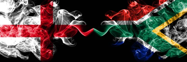 English vs South Africa, African smoky mystic flags placed side by side. Thick colored silky smokes flag of England and South Africa, African. — Stock Photo, Image