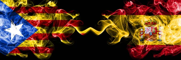 Catalonia vs Spain, Spanish smoke flags placed side by side. Thick colored silky smoke flags of Catalonia and Spain, Spanish — Stock Photo, Image