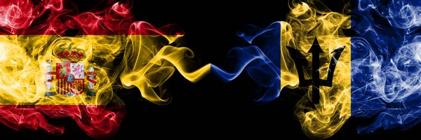 Espanha vs Barbados, bandeiras místicas de fumo barbadiano colocadas lado a lado. Bandeira de fumaça sedosa de cor grossa de espanhol e Barbados, Barbadian — Fotografia de Stock