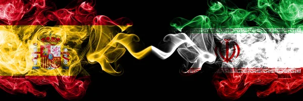 Spain vs Iran, Iranian smoky mystic flags placed side by side. Thick colored silky smokes flag of Spanish and Iran, Iranian — Stock Photo, Image
