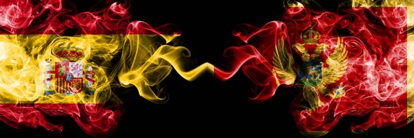 Spanien vs Montenegro, Montenegrin rökig Mystic flaggor placerade sida vid sida. Tjocka färgade silkeslena röker flagga av spanska och Montenegro, Montenegrin — Stockfoto