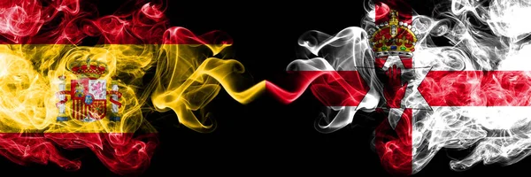 Spain vs Northern Ireland smoky mystic flags placed side by side. Thick colored silky smokes flag of Spanish and Northern Ireland — Stock Photo, Image