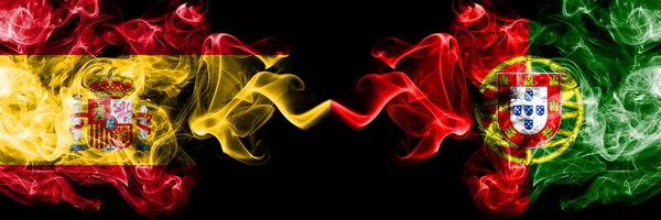 Spain vs Portugal, Portuguese smoky mystic flags placed side by side. Thick colored silky smokes flag of Spanish and Portugal, Portuguese — Stock Photo, Image