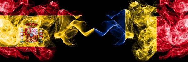 Spain vs Romania, Romanian smoky mystic flags placed side by side. Thick colored silky smokes flag of Spanish and Romania, Romanian — ストック写真