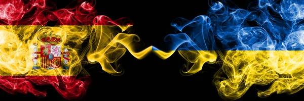 Spain vs Ukraine, Ukrainian smoky mystic flags placed side by side. Thick colored silky smokes flag of Spanish and Ukraine, Ukrainian — Stock Photo, Image