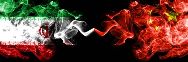 Iran vs China, Chinese smoky mystic states flags placed side by side. Thick colored silky smokes flag combination of Iranian and China, Chinese — Stock Photo, Image