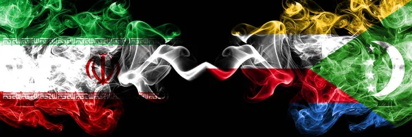 伊朗 vs 科摩罗，科摩罗烟熏神秘状态国旗并排放置。厚厚的彩色丝烟国旗组合伊朗和科摩罗，科摩罗 — 图库照片