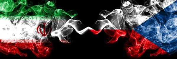 Iran vs Czech Republic smoky mystic states flags placed side by side. Thick colored silky smokes flag combination of Iranian and Czech Republic