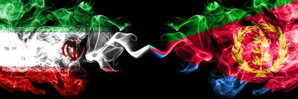 Iran vs Eritrea smoky mystic states flags placed side by side. Thick colored silky smokes flag combination of Iranian and Eritrea — Stock Photo, Image