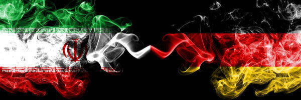 Iran vs Germany, German smoky mystic states flags placed side by side. Thick colored silky smokes flag combination of Iranian and Germany, German