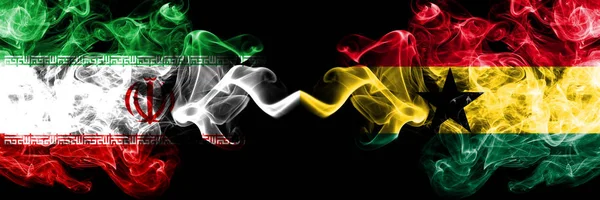 Iran vs Ghana, Ghanaian smoky mystic states flags placed side by side. Thick colored silky smokes flag combination of Iranian and Ghana, Ghanaian — Stock Photo, Image