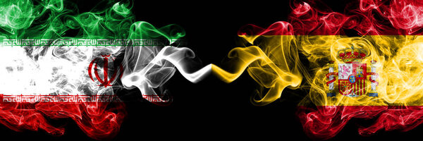Iran vs Spain, Spanish smoky mystic states flags placed side by side. Thick colored silky smokes flag combination of Iranian and Spain, Spanish